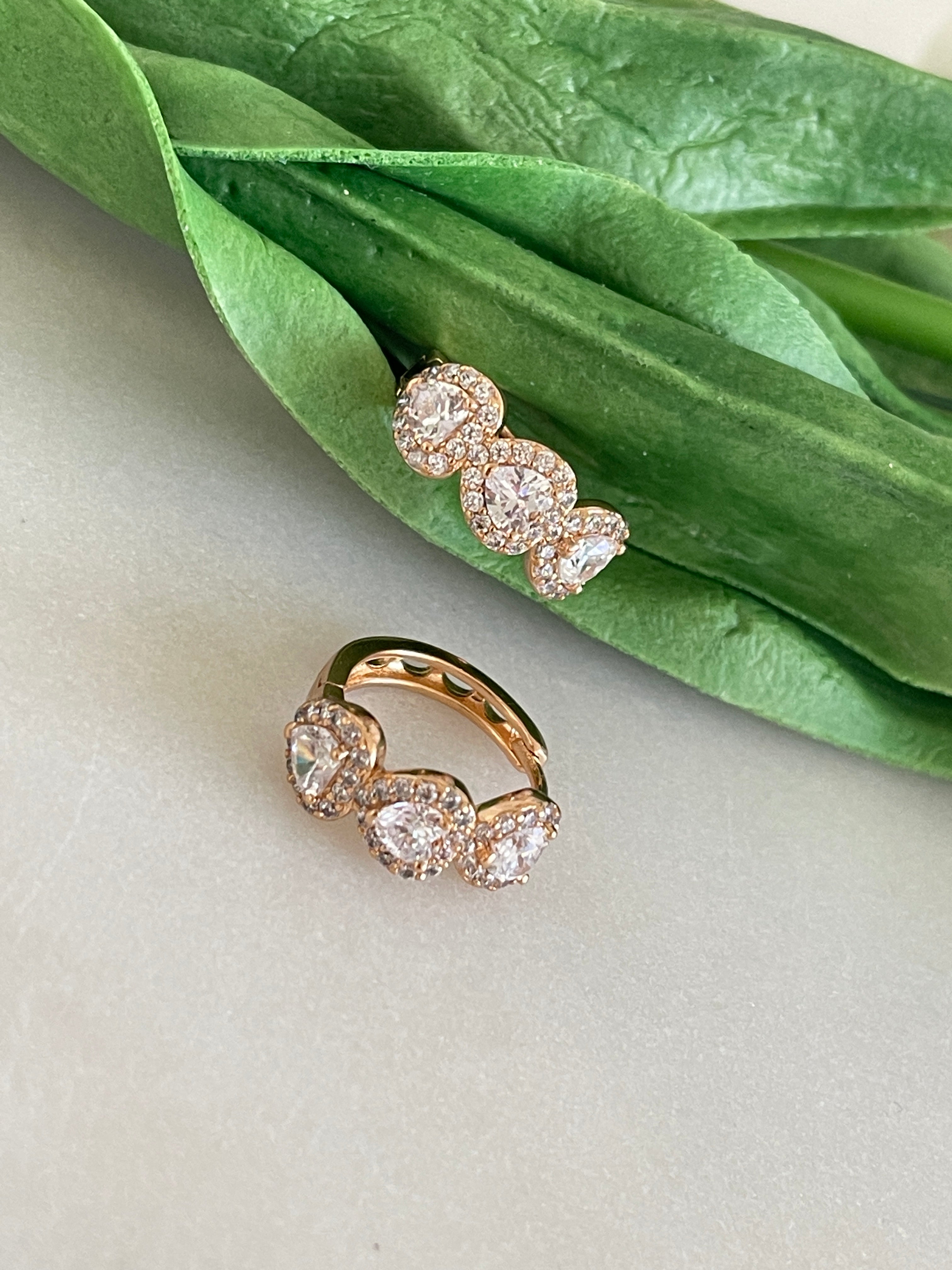 a clock and a plant on a table 