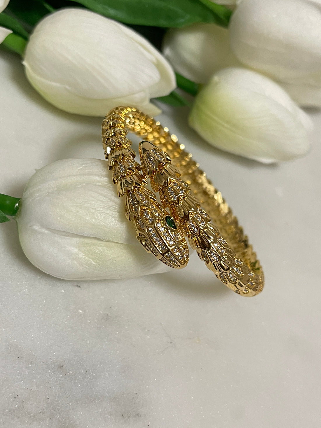 a gold and yellow tie on a white cloth 